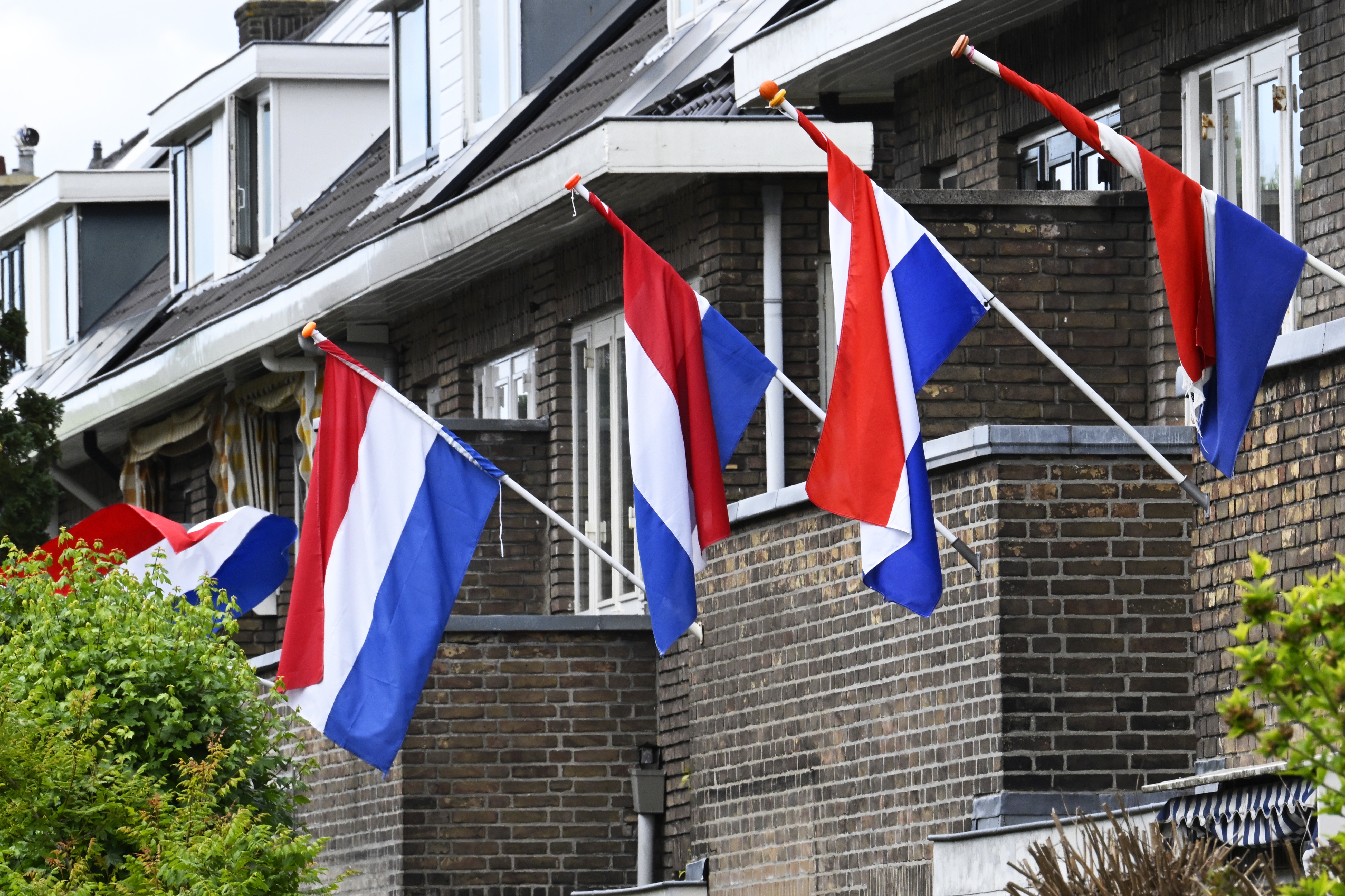 Nederlandse vlaggen aan Rotterdamse gevels tijdens 5 mei. Fotocredits: ANP / Hollandse Hoogte / Peter Hilz
